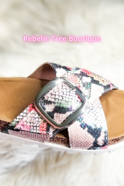 Show off your versatile warm weather style with the Snake Skin Buckle sandals. This sandal features an oversized buckle, medium wide comfortable fit and sporty sole for trendy appeal. 